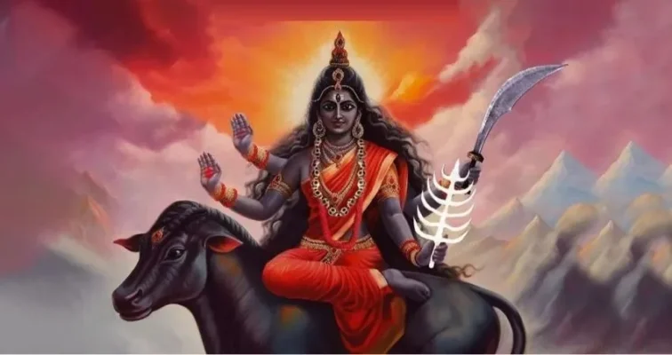 Kaalratri Mata riding a donkey, holding a sword and gesturing blessings.